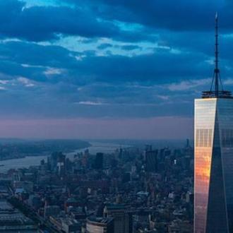 a large body of water with a city in the background